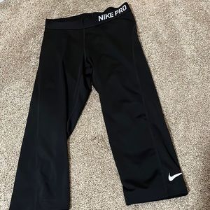 Nike Pro Dri-Fit cropped black leggings.